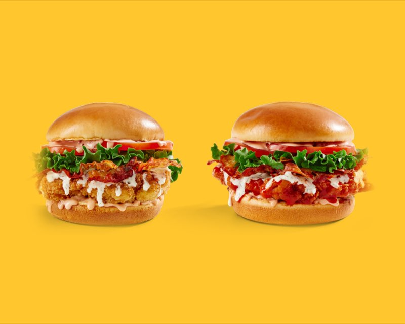 Deluxe Crispy and Deluxe Spicy chicken sandwiches with lettuce, tomato and bacon